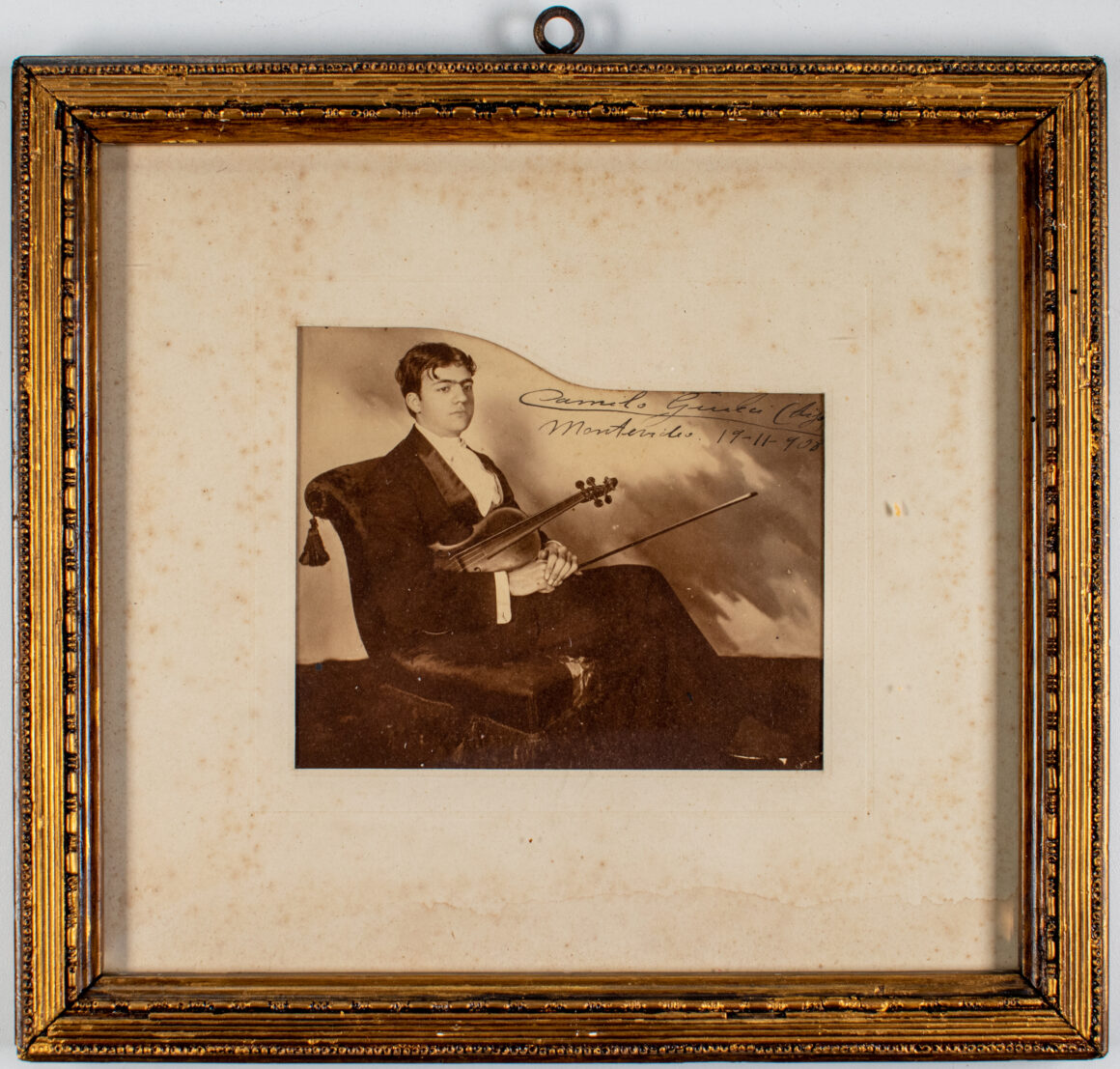 Photographic portrait of Camilo Giucci (son), with dedication to his father, 1909